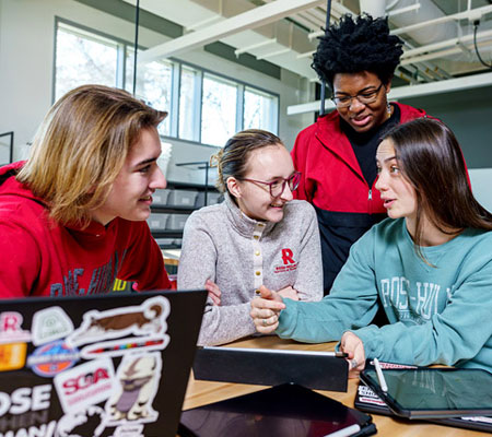 students around laptop