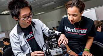 Students adjust device at Rose-Hulman Ventures.