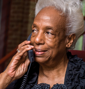 Mary Greer answering the telephone.