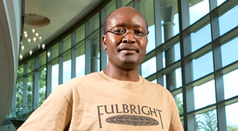 Image shows a professor wearing a Fulbright Scholar T-Shirt in Hatfield Hall.