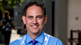 A smiling William Weiner standing outdoors on the Rose-Hulman campus