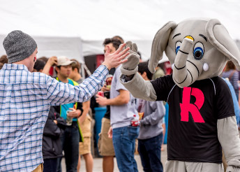 Rosie the Elephant giving a high five