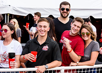Group of young alumni at Homecoming event