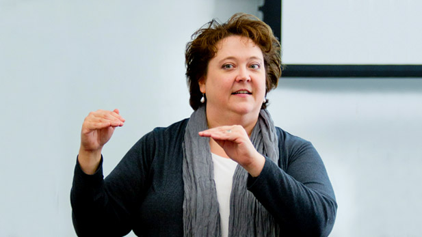Kay C Dee gesturing as she teaches a class.