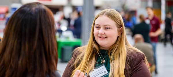A student meets with a recruiter during a campus Career Fair.