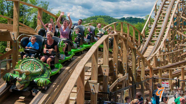Wooden roller coaster designed by The Gravity Group and shaped like a triceratops.