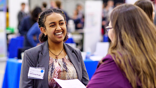 Student meeting with a recruiter during career fair.