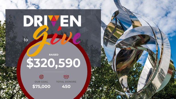 Total amount raised and Flame of the Millennium fountain in the background.