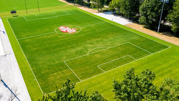 Overhead view of new synthetic soccer field, including Rose-Hulman athletic "Rosie" logo at midfield. 