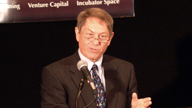 Jim Eifert speaking at a microphone.