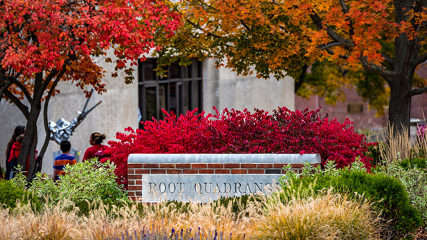 Root Quadrangle sign surrounded by fall foliage.
