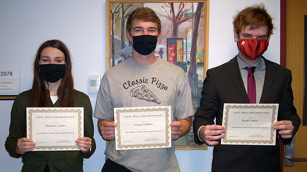 Hannah Snider, George Ritter, and Jacob Reick posing with their Noel Moore Awards.