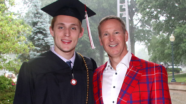 Benjamin Stone in graduation regalia and Robert Stone in a Rose-Hulman plaid tartan jacket.