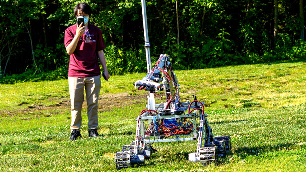 A student drives the Rover Robotics team robot.