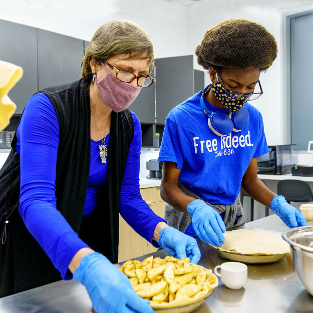 Students work in the New Academic Building's food science lab.