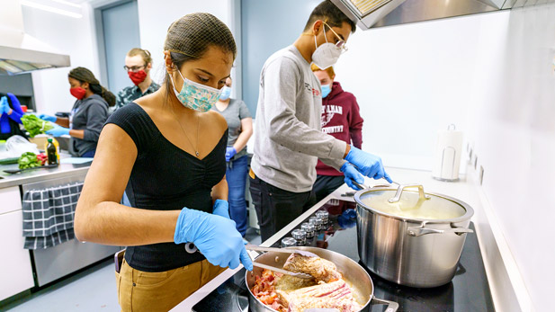 Students work in the New Academic Building's food science lab.