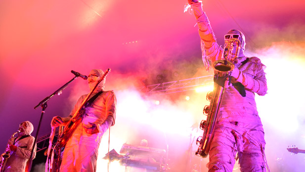 Here Come the Mummies performs amidst a cloud of colored smoke.