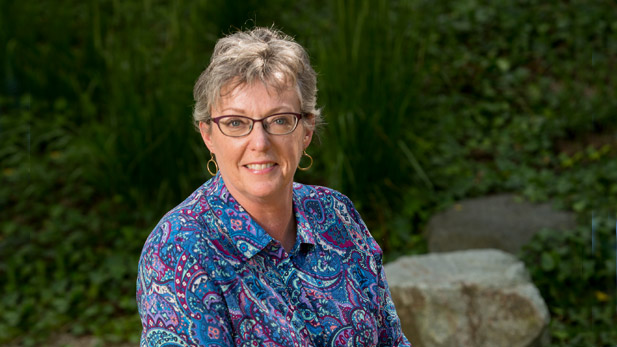Julia Williams sitting outside.