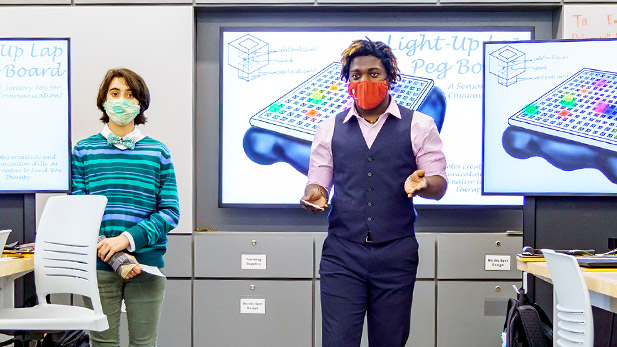 Engineering design students present their toy projects.