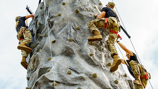 Army ROTC cadets participate in a climbing exercise.