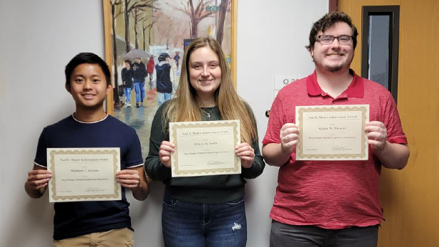 Matthew C. Gerona, Olivya M. Smith, and Quinn W. Thomas with their certificates.