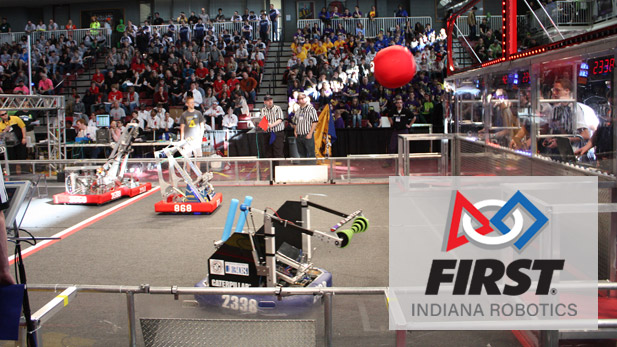 Competition robots battle it out at a First Robotics competition.