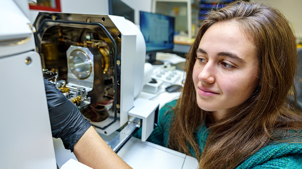 Liz Canon works on a project in a lab.