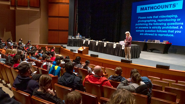 A faculty member speaks to a group of students at the Mathcounts competition hosted by Rose-Hulman.