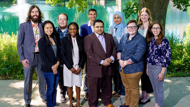 Group photo of new faculty by Speed Lake.