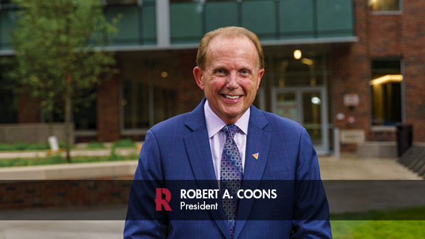 President Robert A. Coons outside the New Academic Building.