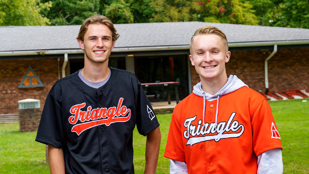 Luke Dawdy and Connor Patton outside the Triangle fraternity house on Rose-Hulman's campus.