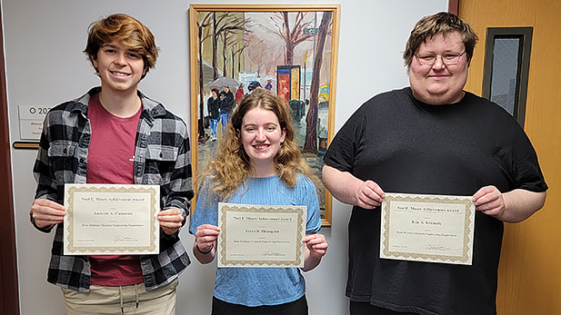Sophomore Andrew (Drew) A. Cameron, junior Freya B. Blomquist, and senior Eric S. Kennedy with their certificates.