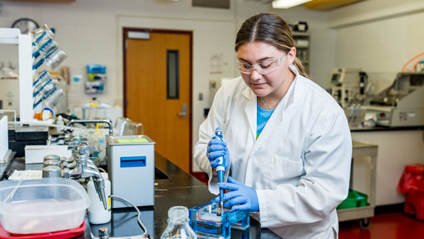 Cassidy Ryan working in a laboratory.