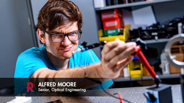 Alfred Moore works on a project in an optical engineering lab.