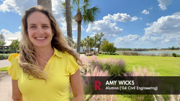 Amy Wicks in front of palm trees.