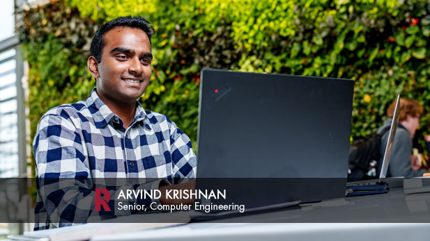 Arvin Krishnan works at a computer in Mussallem Union.