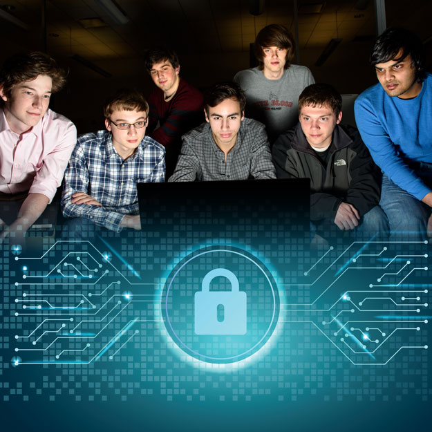 A group of students look at a computer screen intently.