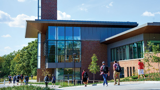 Students walking past Mussallem Union on Rose-Hulman's campus.