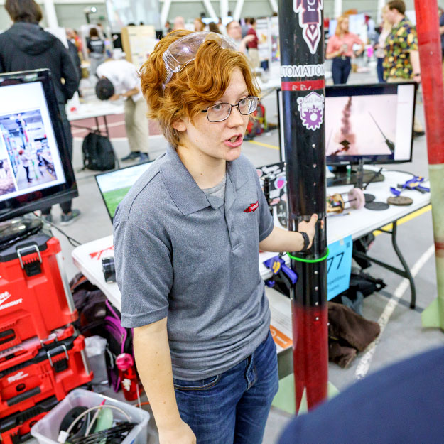 Sam Betts demonstrates a Rose Rocketry Club project at the Rose Show.