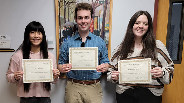 Lily S. Ebright, junior J.B. King, and senior Rebecca E. Breland hold their certificates.