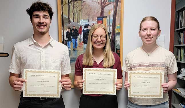 Martin Serbezov, Natalie D. Green, and Lydia J. West pose with their certificates.