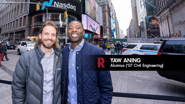 Yaw Aning stands in front of NASDAQ in Times Square.