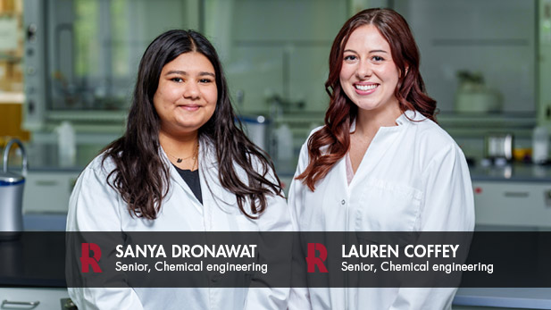 Sanya Dronawat and Lauren Coffey wear their lab coats in a lab in the FAB.