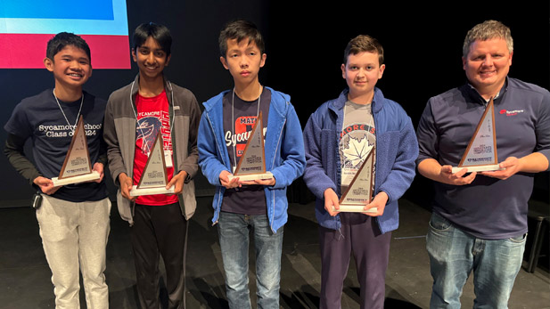 The students and coach representing Indiana at the national MATHCOUNTS competition with their awards.