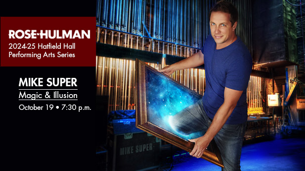 Magician and illusionist Mike Super holds a large frame, which his leg seems to disappear behind.