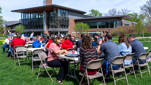 Faculty and staff enjoy a lunch on BSB lawn.