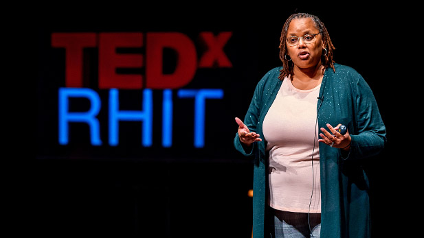 Carlotta Berry speaks on the TedxRHIT stage.