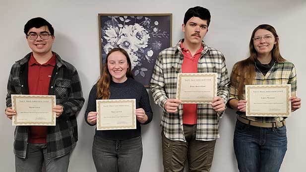 Sophomore David Creen, junior Makenna Gill, senior Drake Bauernfeind, and senior Laura Wacaser