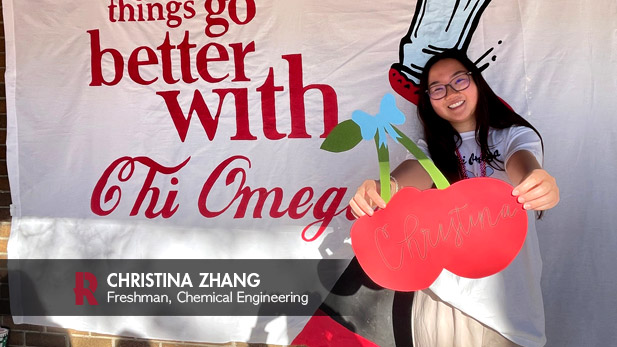 Christina Zhang is holding her name tag during Chi Omega Sorority event.