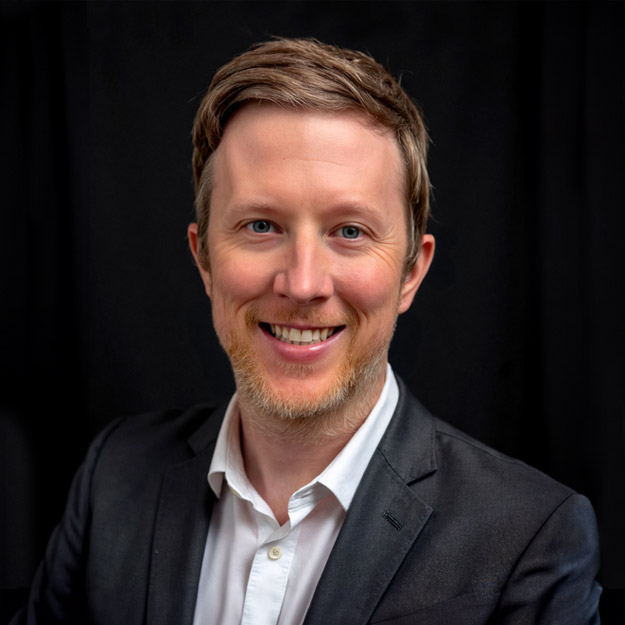 Mike Reust with his wife and toddler daughter.